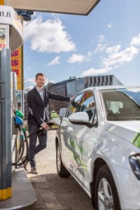 A man filling a car on gas station.